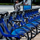 Bicycles that are part of the NYC Bike Share program are lined up at a dock and lock station at the Brooklyn Navy Yards in New York.